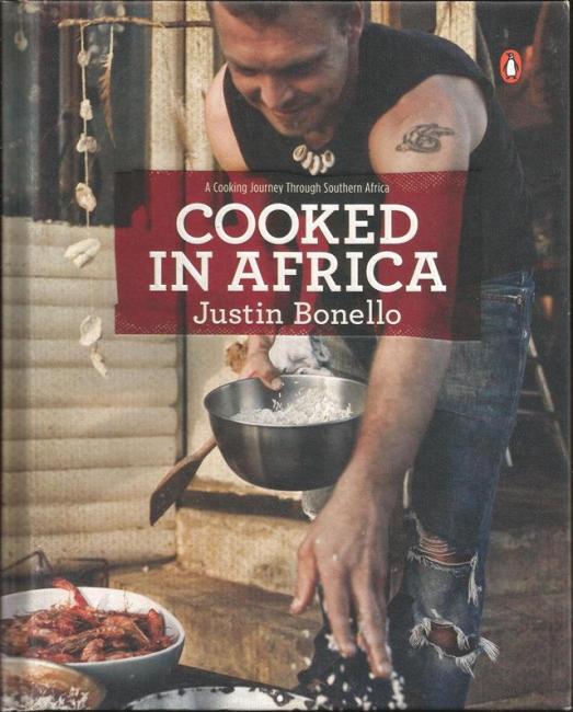 Front cover of Cooked in Africa by Justin Bonello